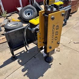 AGT 680 skid loader post driver